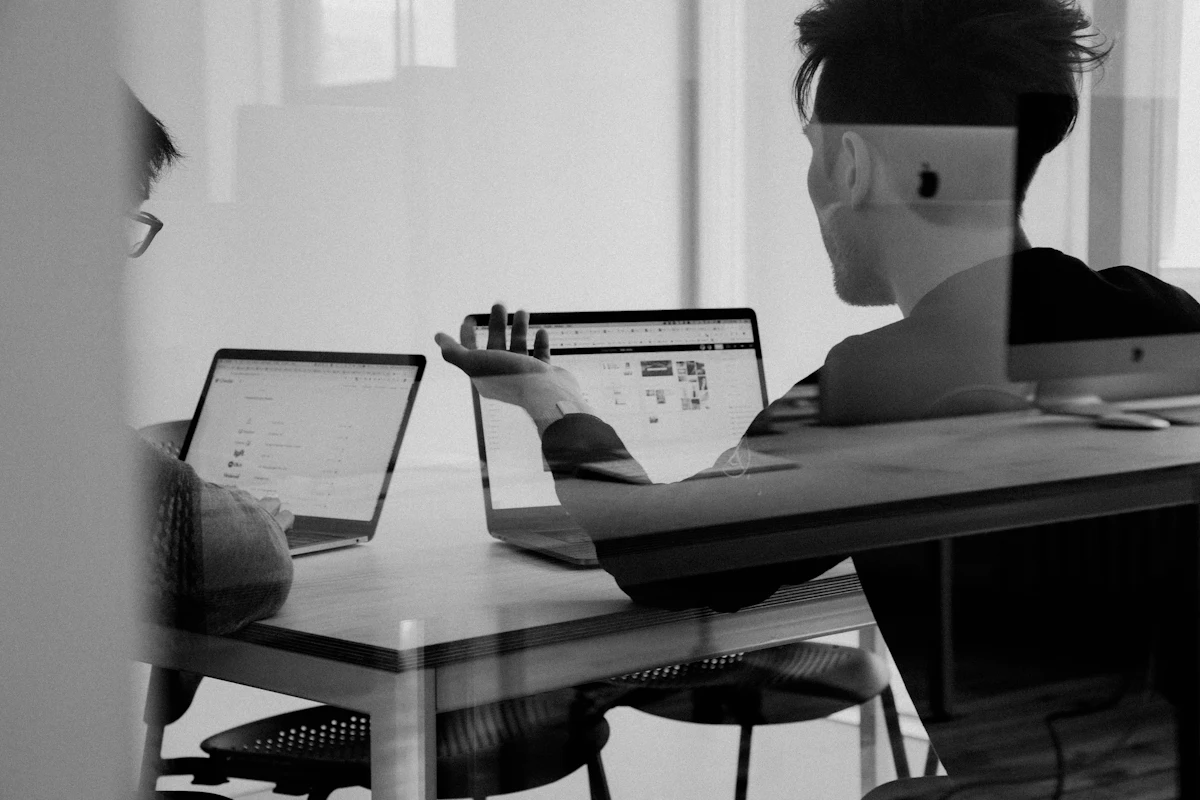 Four professionals reviewing documents together in the studio